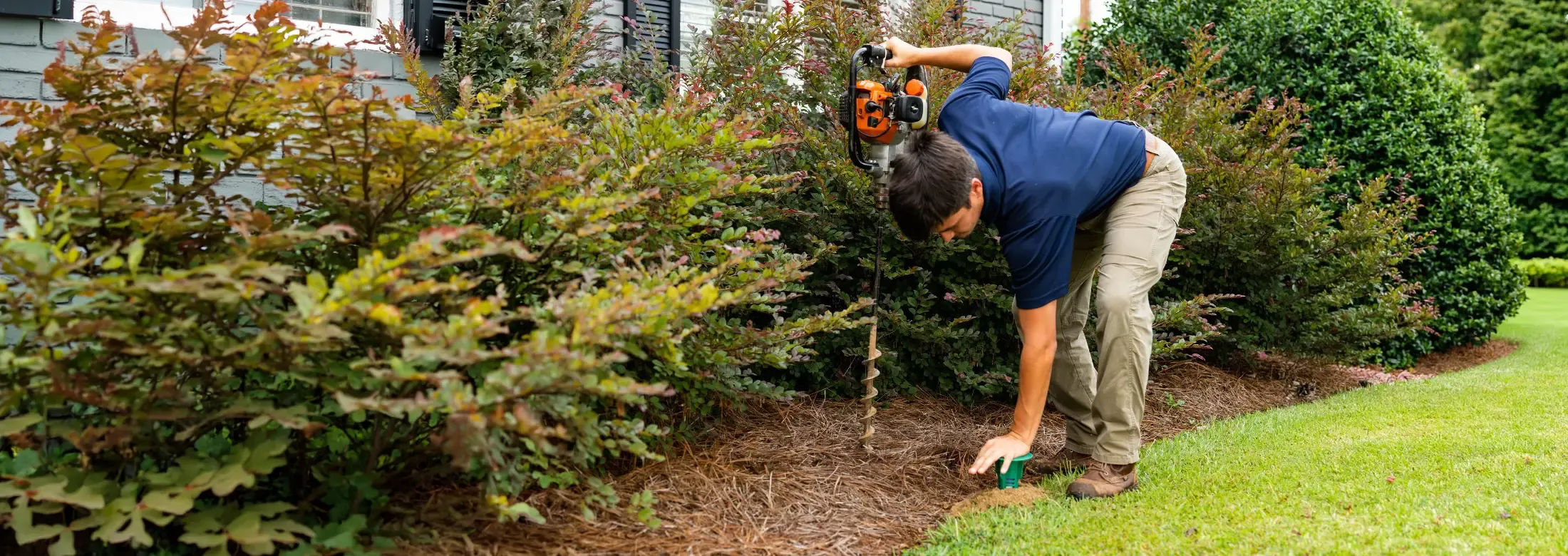 termite control technician installing termite bait